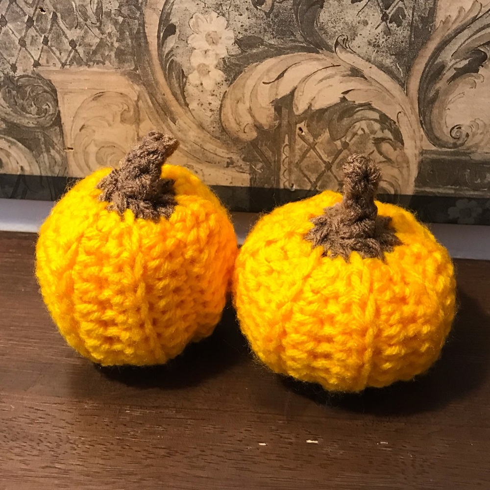 2 Mini crochet pumpkins.